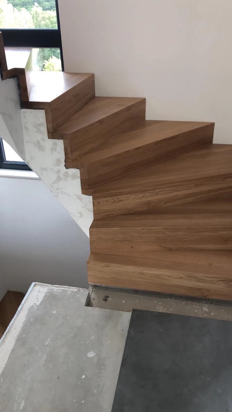 Concrete shell staircase as the starting point before the solid wood cladding — reinforced-concrete structure