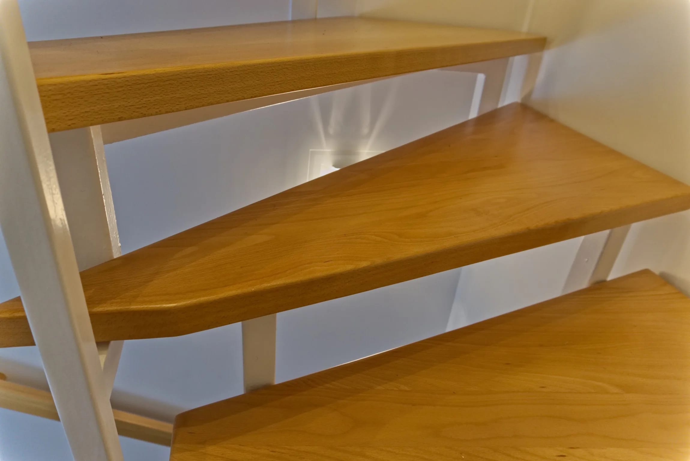 Solid beech steps as new cladding — an example of a tread replacement on a clad staircase
