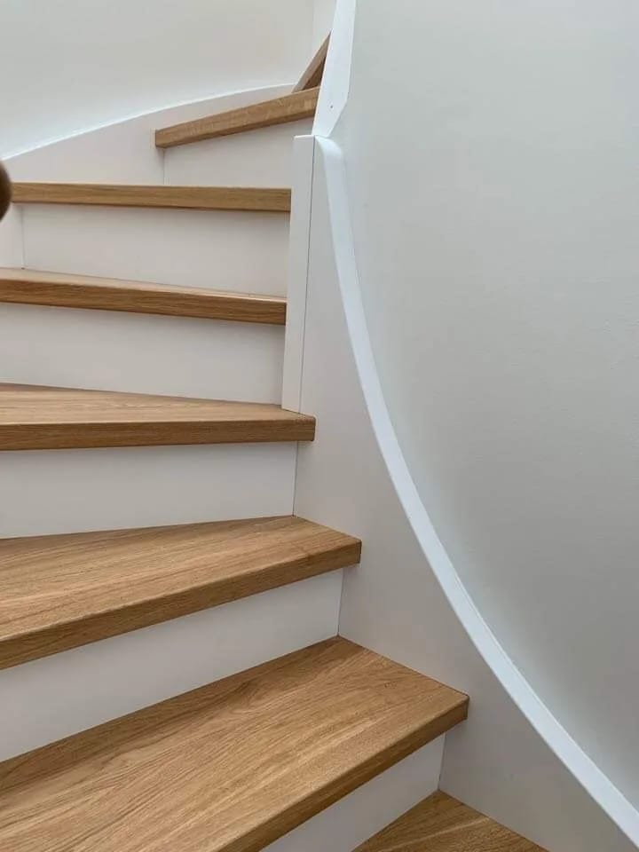 Oak stringer staircase with white stringers — individual custom build from Witten