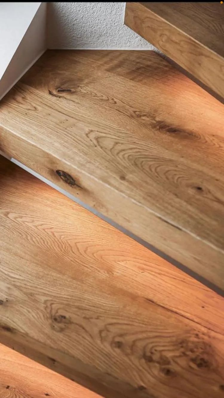 Solid oak step as new cladding for a concrete or metal staircase — contour-accurate, made in our Witten workshop
