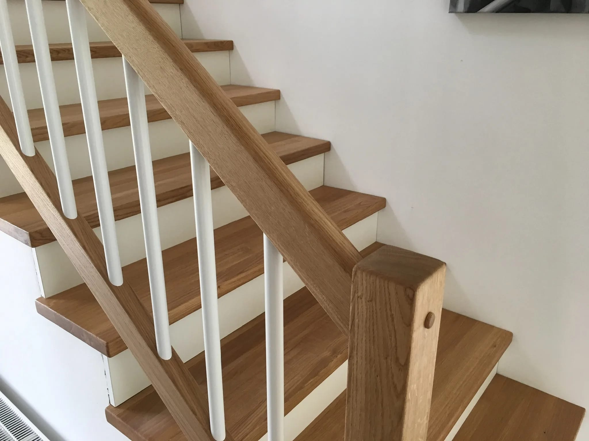 Solid wood treads as cladding for metal staircases — six woods and three surfaces to choose from