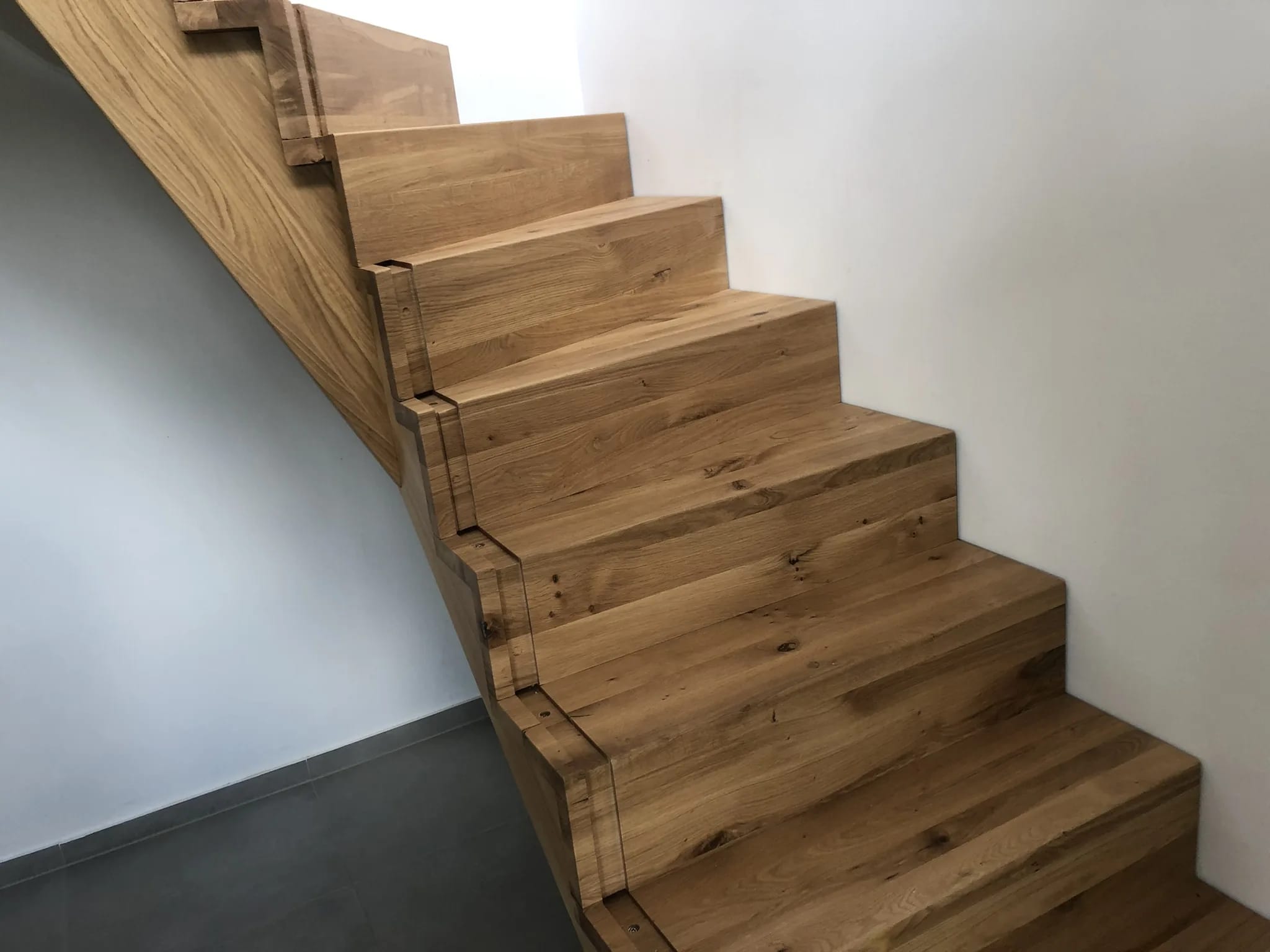 Sculptural folded staircase in oak on stringer beams — individual custom build from Witten